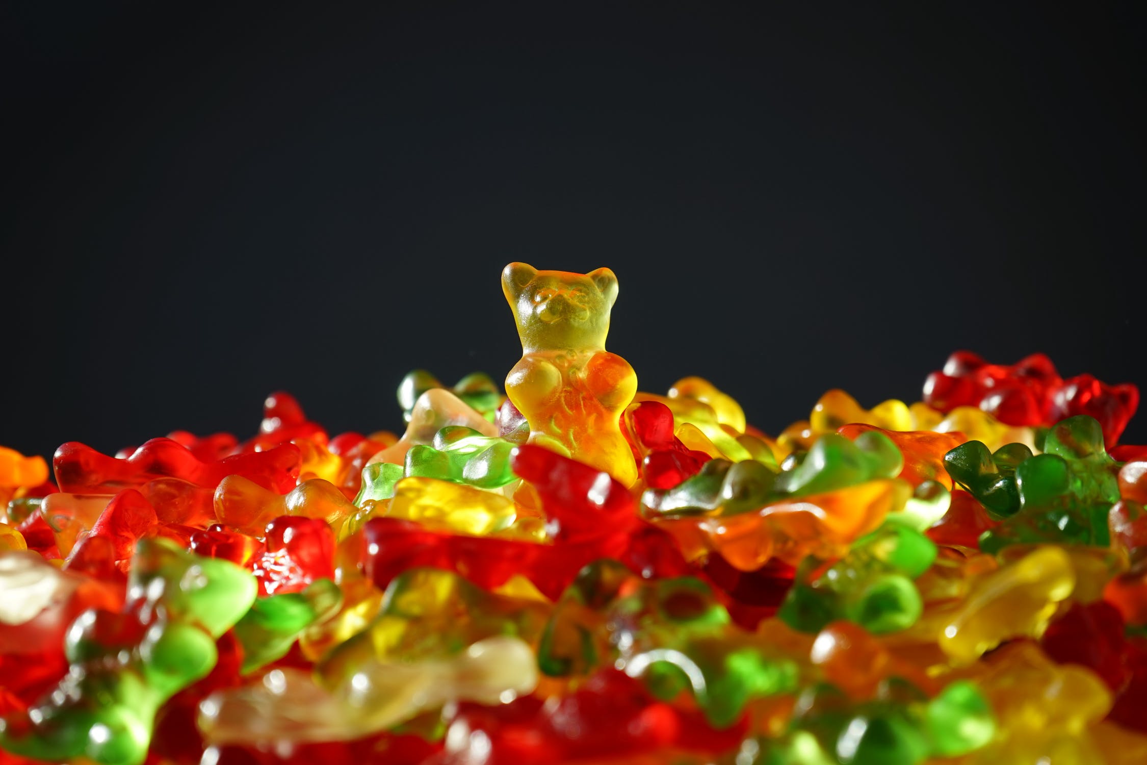multiple gummy bears of varying colors